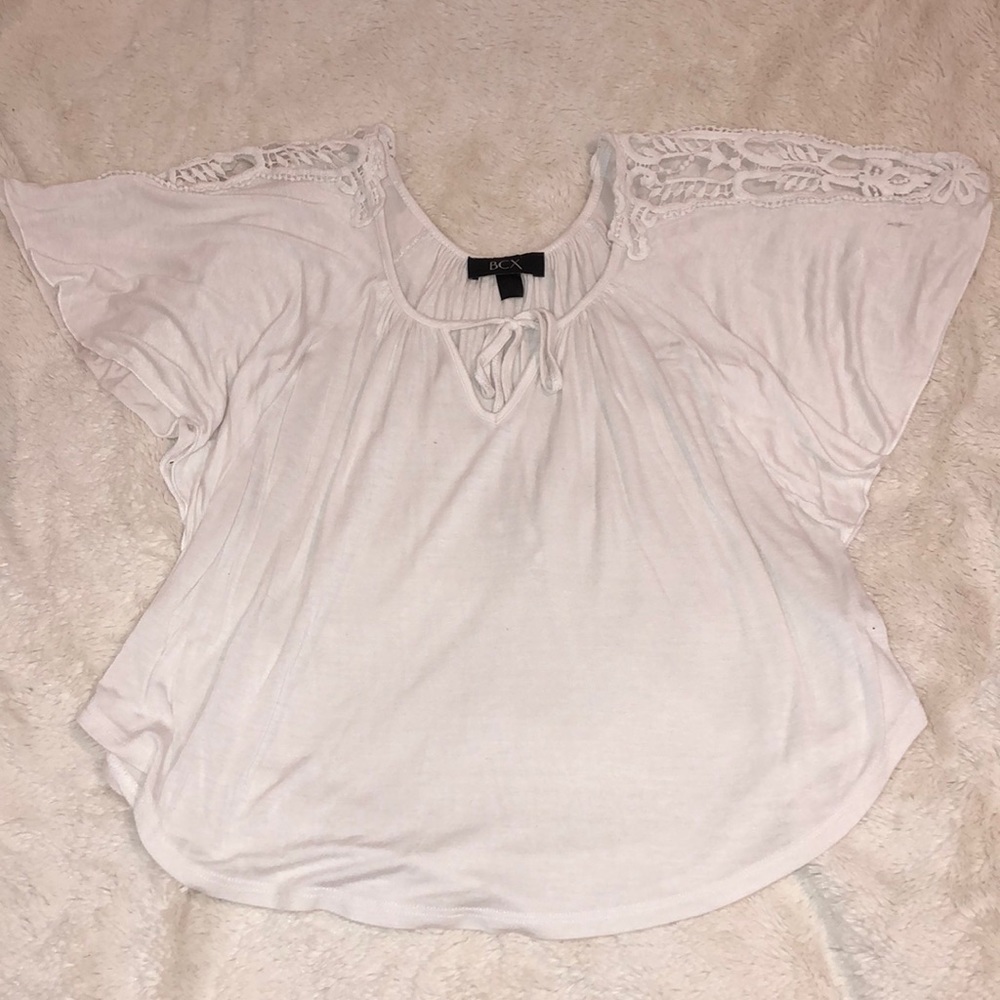 White blouse with white embroidery on sleeves